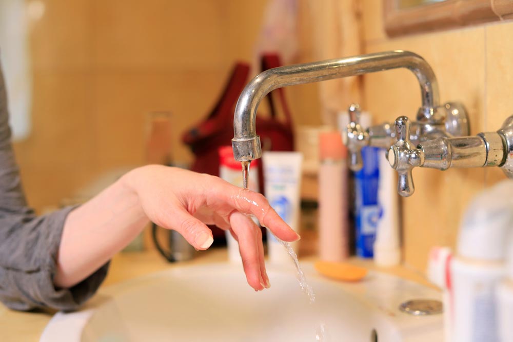 low-pressure water coming from a kitchen faucet
