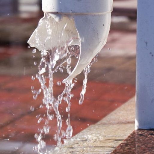 The plastic pipe burst through the water. The water flows