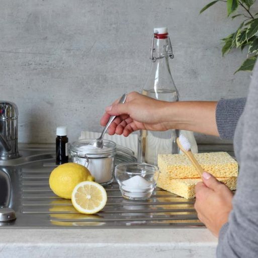 Vinegar and baking soda bottles on sink
