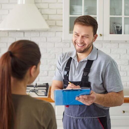 homeowner talking to a plumber