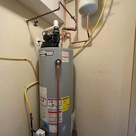 Water heater being cleaned