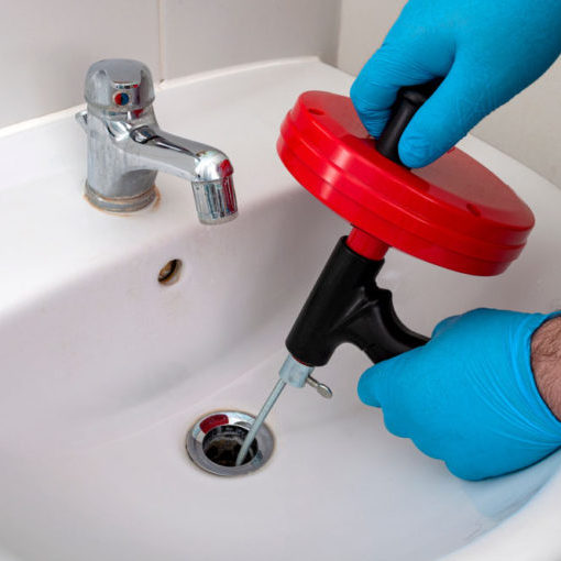 plumber uses drain snake Greenwich, CT