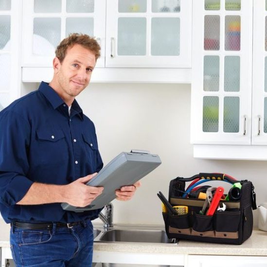 Professional plumber doing renovation in kitchen home.