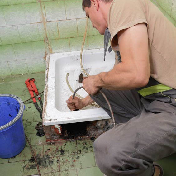 10506765 - plumber cleaning  drain in bathroom with cable